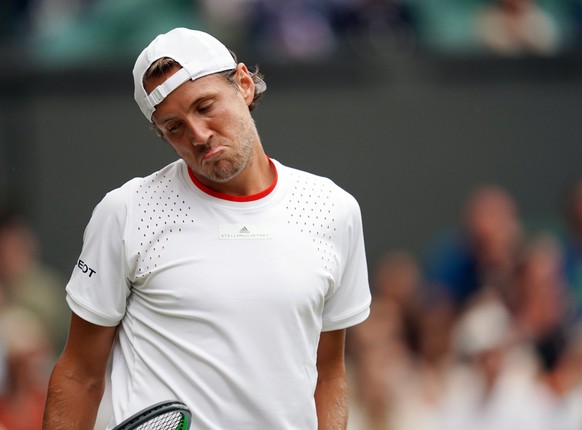 epa07699430 Lucas Puille of France plays Roger Federer of Switzerland in their third round match during the Wimbledon Championships at the All England Lawn Tennis Club, in London, Britain, 06 July 201 ...