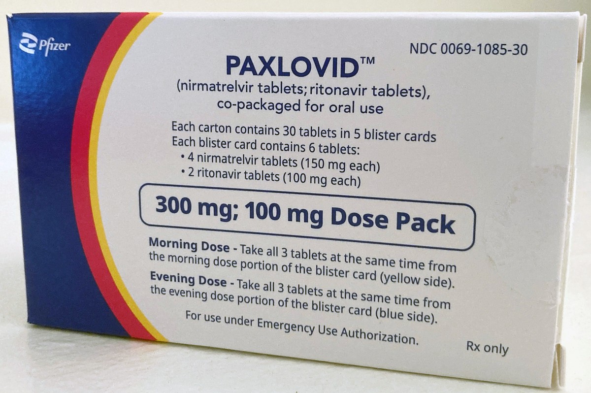 FILE - The anti-viral drug Paxlovid is displayed in New York, Aug. 1, 2022. For some people with COVID-19, antiviral pills that can be taken at home can lessen the chances of winding up in the hospita ...