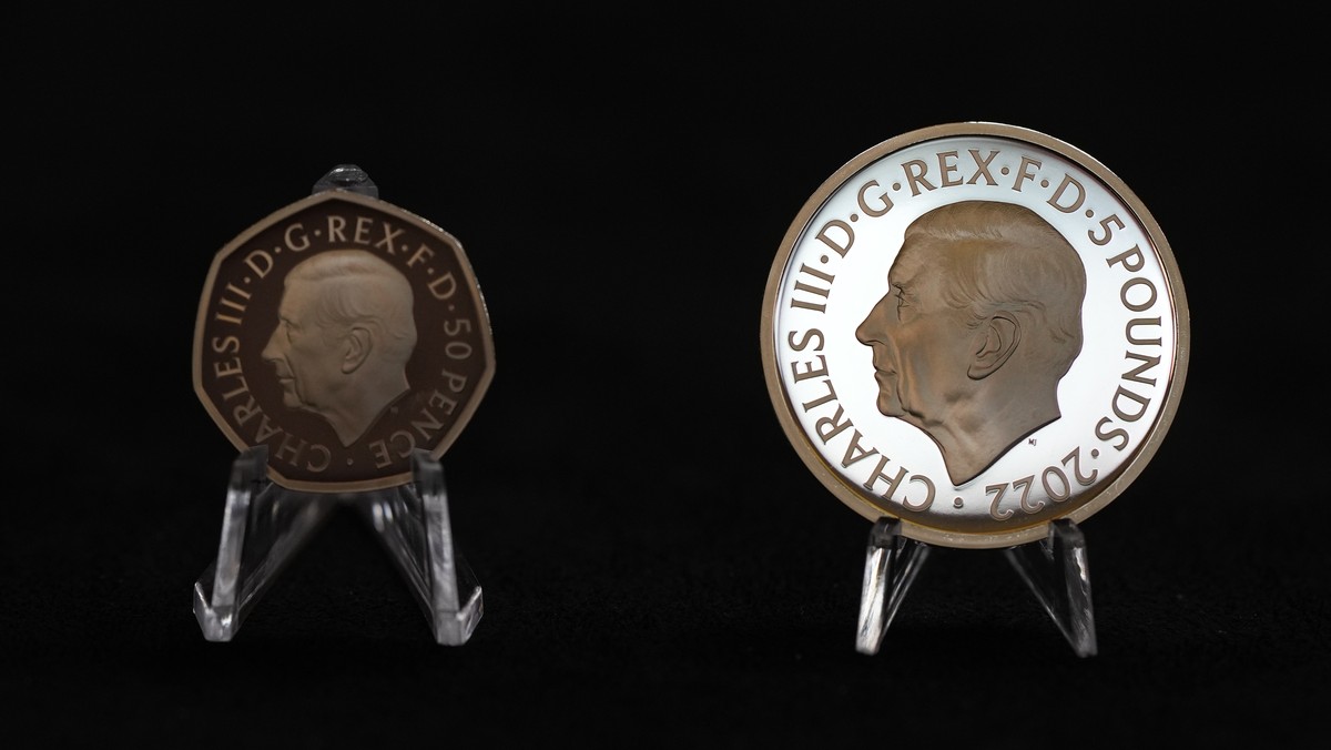 Two new coins bearing official coinage portrait of King Charles III, on the left is the new 50 pence coin, and right is the new 5 pound commemorative coin, which will be among the first coins to bear  ...