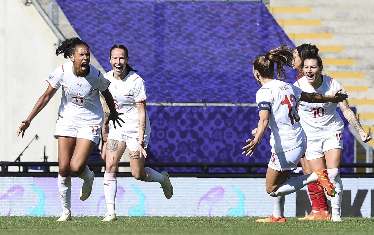 epa10061970 Coumba Sow (L) of Switzerland celebrates after scoring the 1-0 lead during the Group C match of the UEFA Women's EURO 2022 between Portugal and Switzerland in Leigh, Britain, 09 July  ...