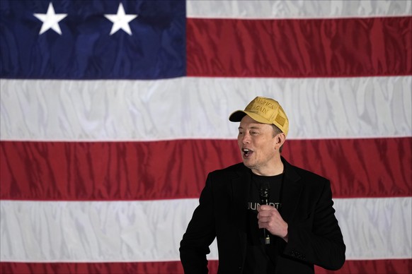 Elon Musk speaks as part of a campaign town hall in support of Republican presidential nominee former President Donald Trump in Folsom, Pa., Thursday, Oct. 17, 2024. (AP Photo/Matt Rourke)