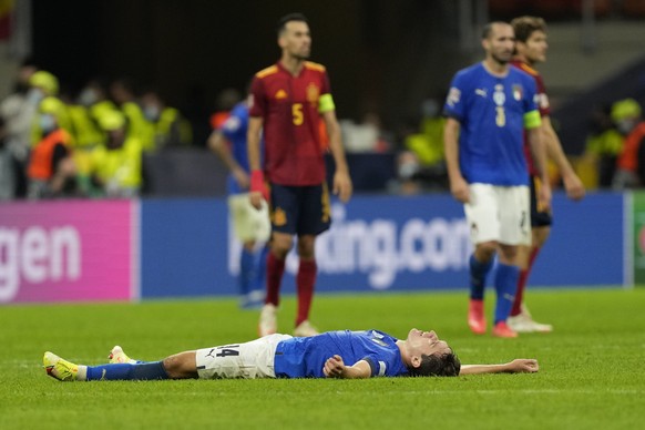 Italy&#039;s Federico Chiesa lies on the pitch at the end of the UEFA Nations League semifinal soccer match between Italy and Spain at the San Siro stadium, in Milan, Italy, Wednesday, Oct. 6, 2021. ( ...