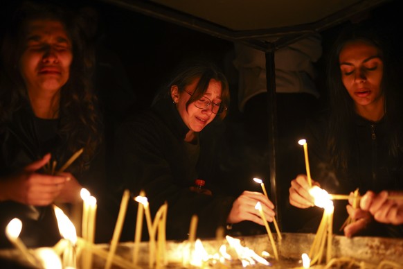 Girls cry as they light candles in the town of Kocani, North Macedonia, Sunday, March 16, 2025, following a massive fire in the nightclub early Sunday. (AP Photo/Armin Durgut)
North Macedonia Nightclu ...