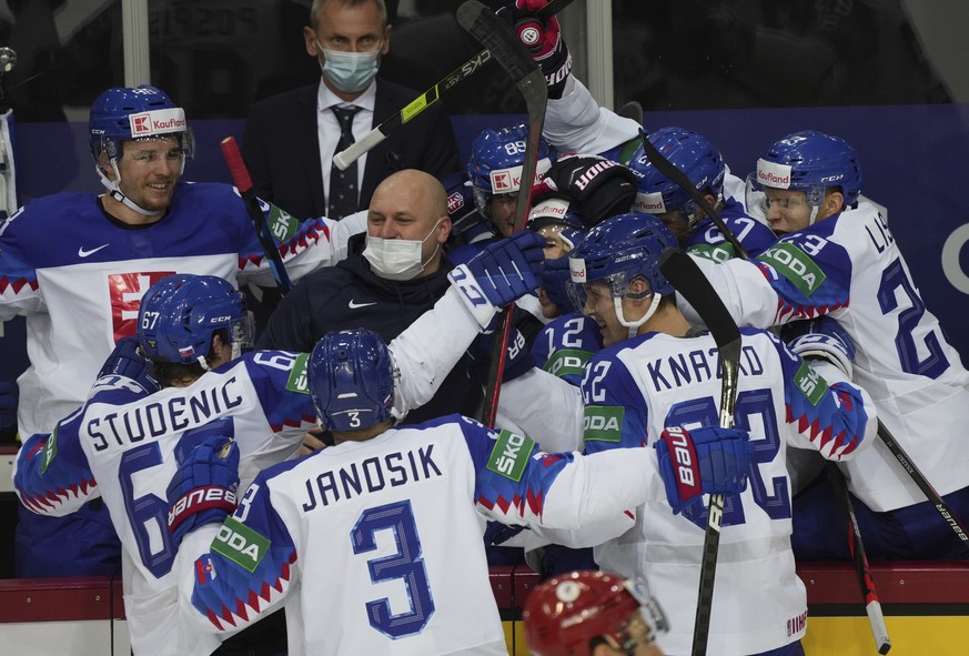 Slovakia's team players celebrate goal during the Ice Hockey World Championship group A match between the Slovakia and Russia at the Olympic Sports Center in Riga, Latvia, Monday, May 24, 2021. (AP Ph ...