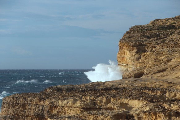 Waves break against the cliffs where the structure known as the Azure Window, because it arched over blue seas popular with divers, collapsed as the Maltese islands were hit by rough seas and stormy w ...