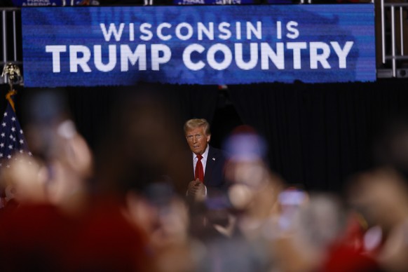 epa11696832 Republican presidential candidate Donald J. Trump takes the stage during a campaign event at Fiserv forum in Milwaukee, Wisconsin, USA, 01 November 2024. Trump is running against Democrati ...