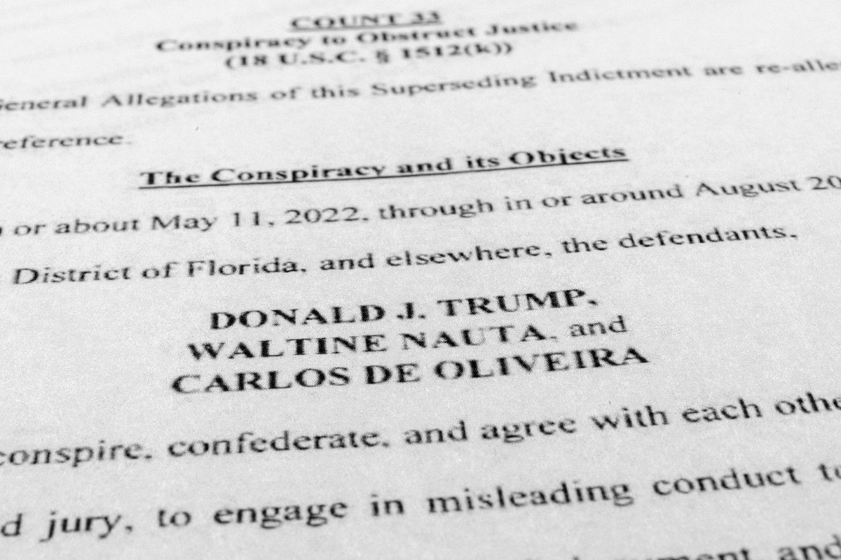 The updated indictment against former President Donald Trump, Walt Nauta and Carlos De Oliveira is photographed Thursday, July 27, 2023. Trump is facing accusations that he and aides asked a staffer t ...