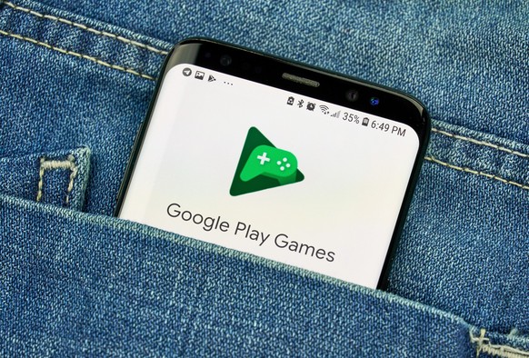 MONTREAL, CANADA - OCTOBER 4, 2018: Google Play Games, online gaming service and software on s8 screen. Google is an American technology company which provides a variety of internet services.