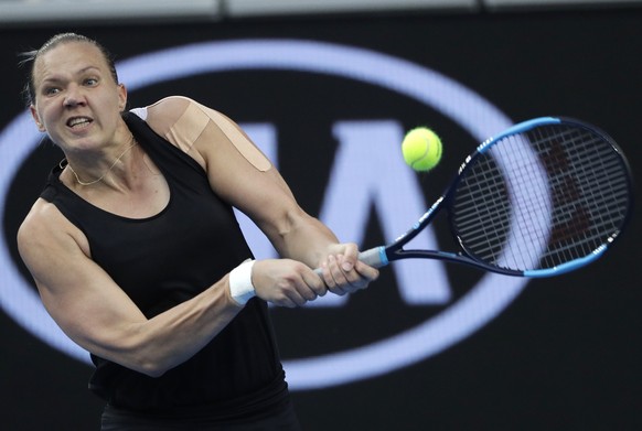 Estonia&#039;s Kaia Kanepi hits a backhand return to Romania&#039;s Simona Halep during their first round match at the Australian Open tennis championships in Melbourne, Australia, Tuesday, Jan. 15, 2 ...