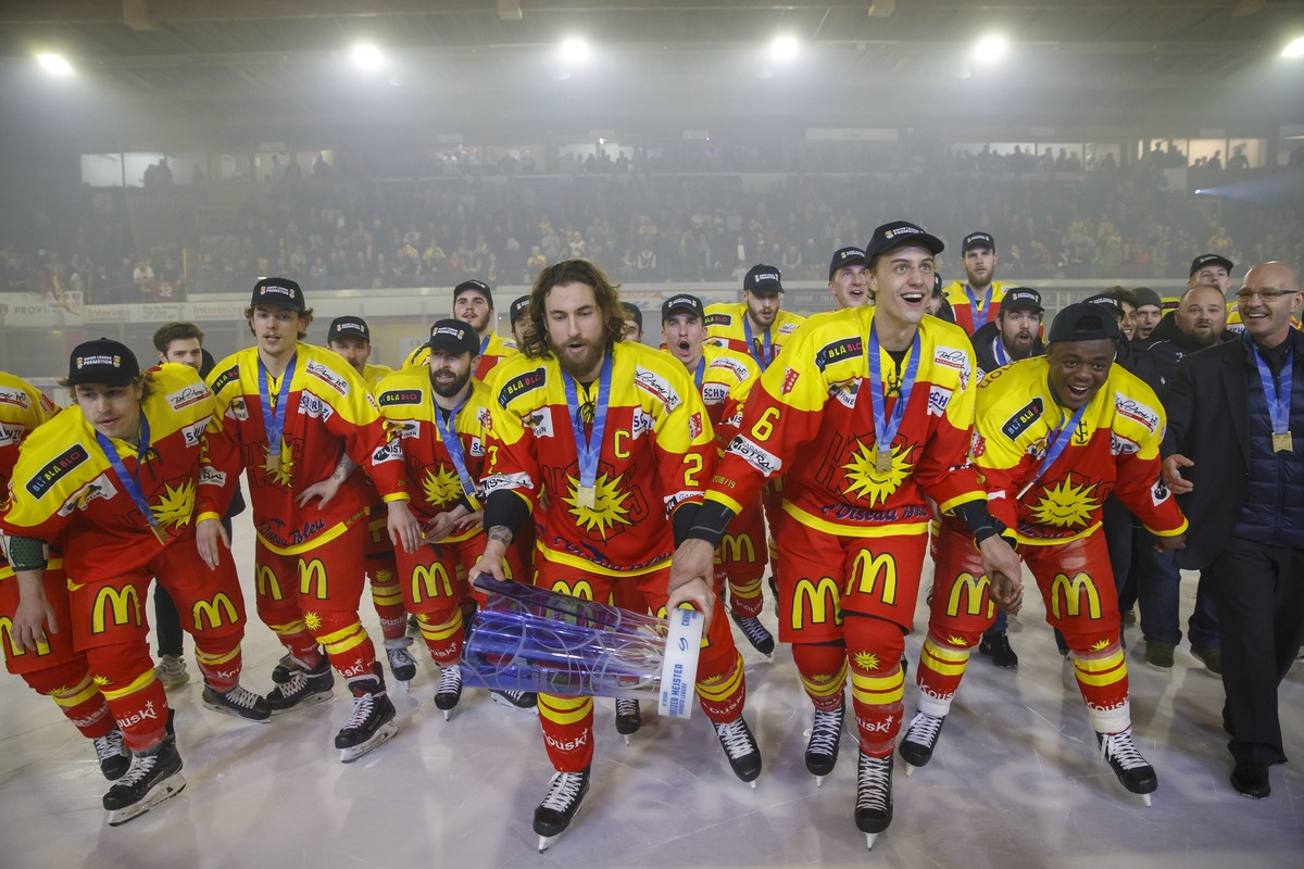 Sierre's captain defender Kyllian Guyenet lifts the winner's trophy of the MySports League Swiss Championship between his teammates after Sierre's victory over Valais Chablais, in the f ...