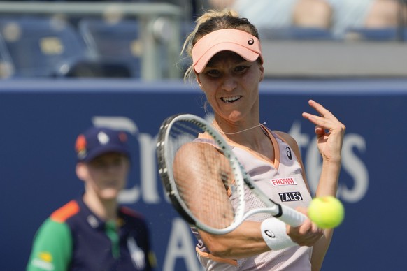 Victoria Golubic, of Switzerland, returns a shot to Paula Badosa, of Spain, during the first round of the U.S. Open tennis championships, Monday, Aug. 26, 2024, in New York. (AP Photo/Julia Nikhinson)