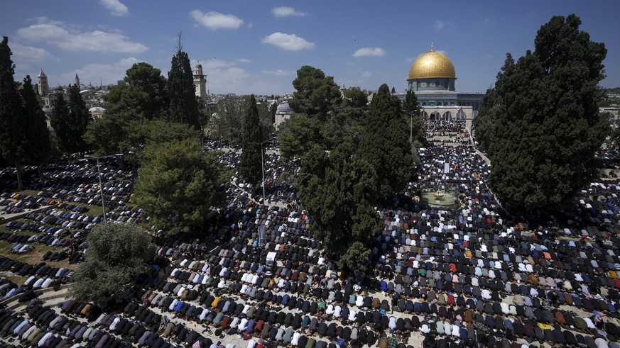 Muslim worshippers perform Friday prayers at the Al-Aqsa Mosque compound in the Old City of Jerusalem, during the Muslim holy month of Ramadan, Friday, April 14, 2023. (AP Photo/Mahmoud Illean)