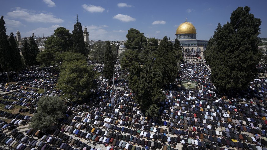 Muslim worshipers perform Friday prayers in the grounds of Al-Aqsa Mosque in Jerusalem's Old City during the Islamic holy month of Ramadan, Friday, April 14, 2023. (AP Photo/Mahmoud Illean)