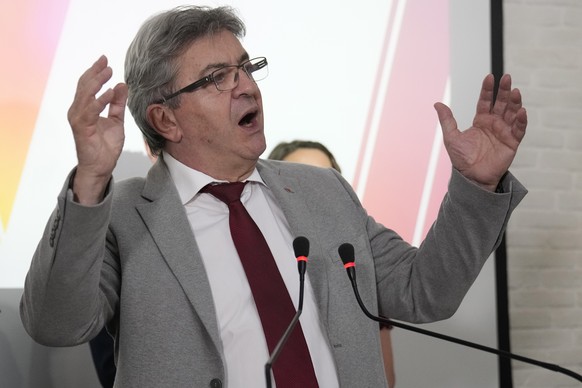 Hard-left leader Jean-Luc Melenchon delivers a speech at his election night headquarters after the first round of the parliamentary election Sunday, June 12, 2022 in Paris. Projections show French Pre ...