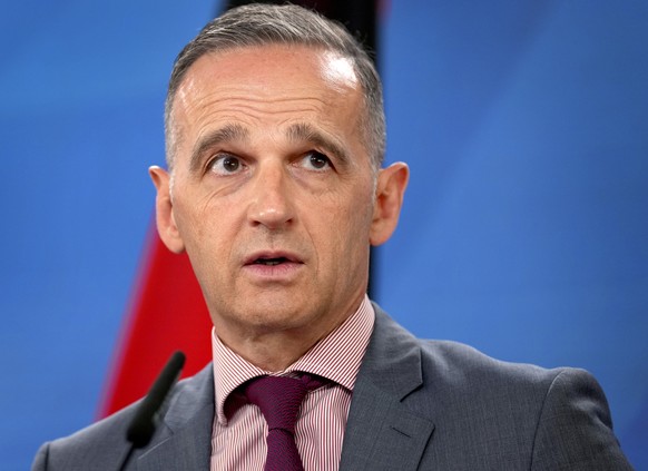 epa09409898 German Foreign Minister Heiko Maas addresses the media during a joint press conference with his counterpart from Bahrain, Abdullatif bin Rashid Al-Zayani, after a meeting in Berlin, German ...