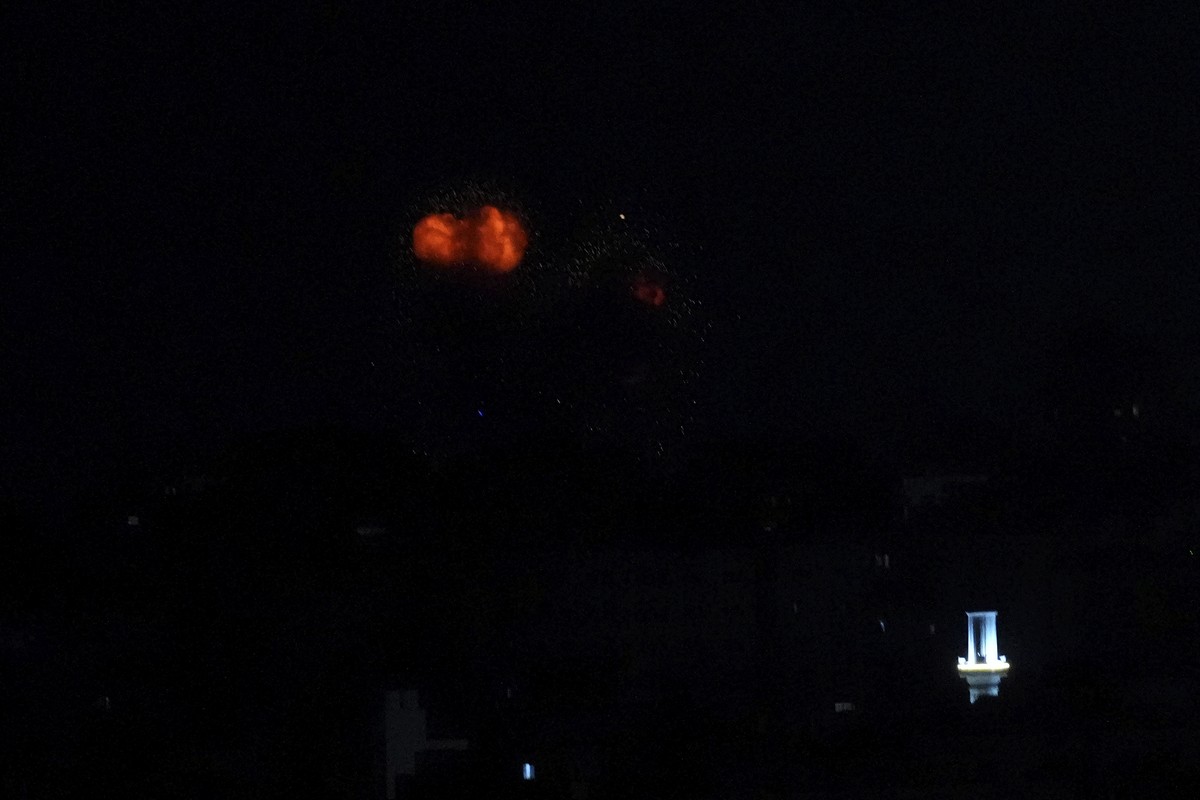 Smoke and fire rise from an explosion caused by an Israeli airstrike on Gaza City, early Wednesday, July 5, 2023. The Israeli army said militants in the Gaza Strip launched five rockets into Israel. I ...
