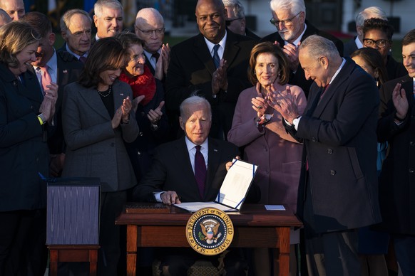 President Joe Biden signs the &quot;Infrastructure Investment and Jobs Act&quot; during an event on the South Lawn of the White House, Monday, Nov. 15, 2021, in Washington. (AP Photo/Evan Vucci)
Joe B ...