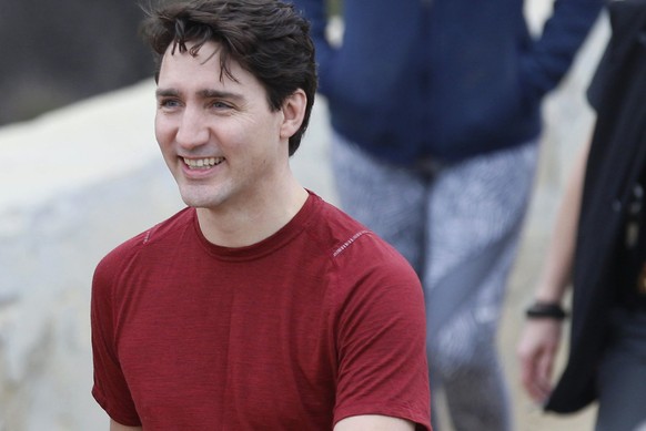 Canadian Prime Minister Justin Trudeau, right, with Los Angeles Mayor Eric Garcetti smiles after a hike in the hills surrounding the Griffith Observatory Saturday, Feb. 10, 2018. (AP Photo/Damian Dova ...