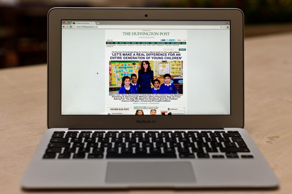 LONDON, ENGLAND - FEBRUARY 17: In this photo illustration, the Huffington Post homepage is shown on an Apple Macbook Air on February 17, 2016 in London, England. Today The Duchess Of Cambridge will gu ...