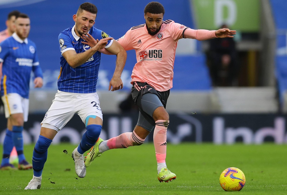 Andi Zeqiri of Brighton swatted aside by Jayden Bogle of Sheffield Utd during the Premier League match at the AMEX Stadium, Brighton and Hove. Picture date: 19th December 2020. Picture credit should r ...