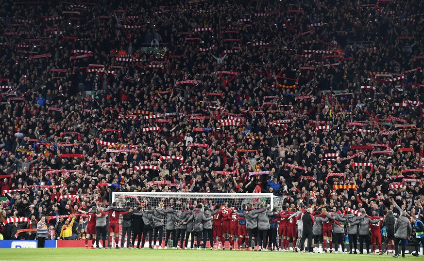 epa07554701 Liverpool players celebrate in front of their fans after the UEFA Champions League semi final 2nd leg match between Liverpool FC and FC Barcelona at Anfield, Liverpool, Britain, 07 May 201 ...
