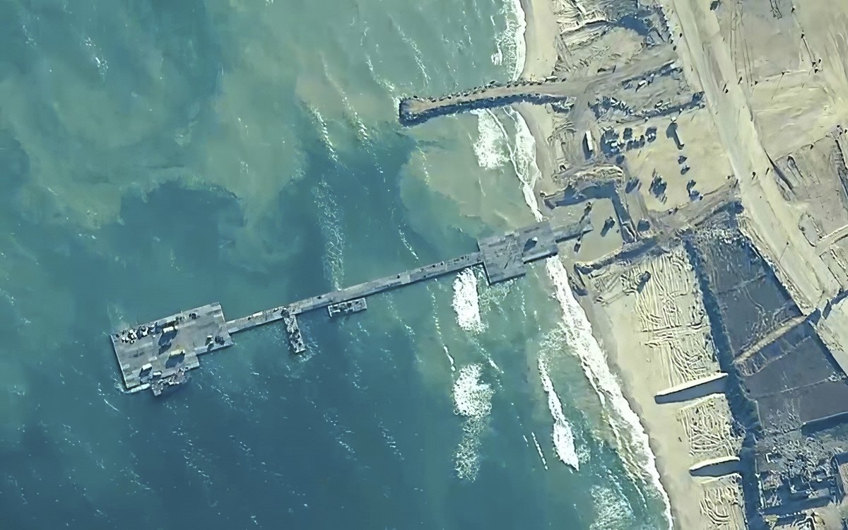 FILE - The image provided by U.S, Central Command, shows U.S. Army soldiers assigned to the 7th Transportation Brigade (Expeditionary), U.S. Navy sailors assigned to Amphibious Construction Battalion  ...
