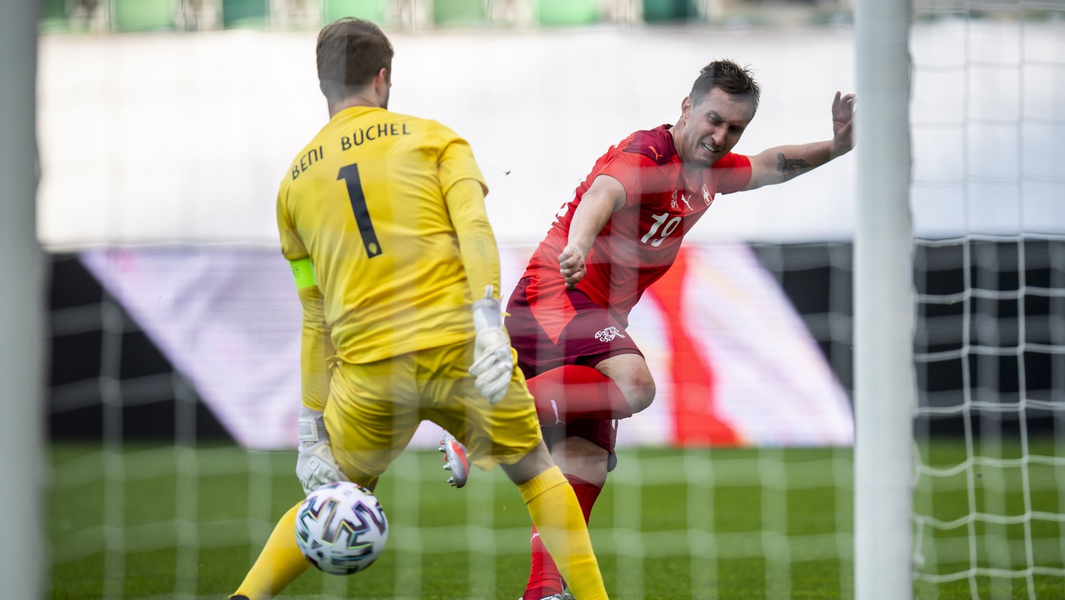 epa09245731 Liechtenstein&#039;s goalkeeper Benjamin Buechel (L) in action against Switzerland&#039;s Mario Gavranovic (R) during the International Friendly soccer match between Switzerland and Liecht ...