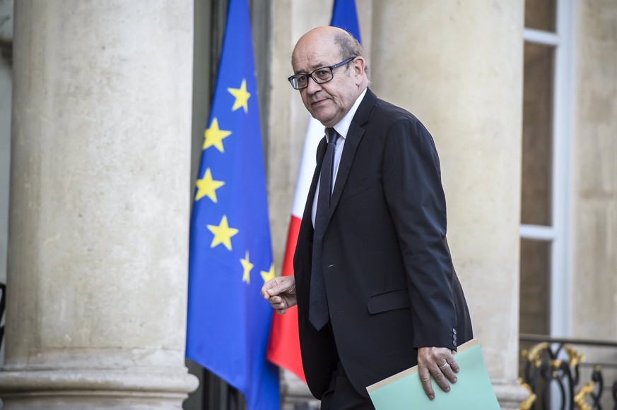 epa05918603 French Defense Minister Jean-Yves Le Drian arrives at the Elysee Palace for a defense council meeting, in Paris, France, 21 April 2017. A police officer was killed in a terror attack near  ...