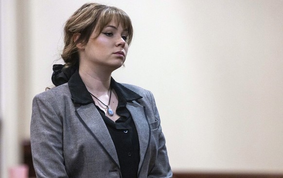 Defendant Hannah Gutierrez-Reed, former armorer on the set of the movie &quot;Rust&quot;, walks back to her seat after speaking with District Judge Mary Marlowe Sommer before her trial at District Cou ...