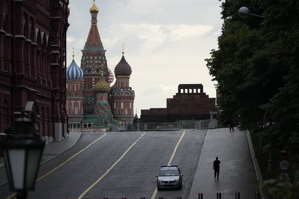 A man walks from an empty Red Square with St. Basil's Cathedral and Lenin's Mausoleum in the background in Moscow, Russia, Wednesday, June 28, 2023. Life is back to normal in the Russian c...