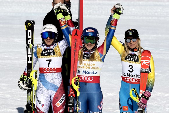 Silver medalist Wendy Holdener, of Switzerland, left, Gold medalist Mikaela Shiffrin, of the U.S.A., center, and Bronze medalist Frida Hansdotter, of Sweden, celebrate, during the flower ceremony of t ...