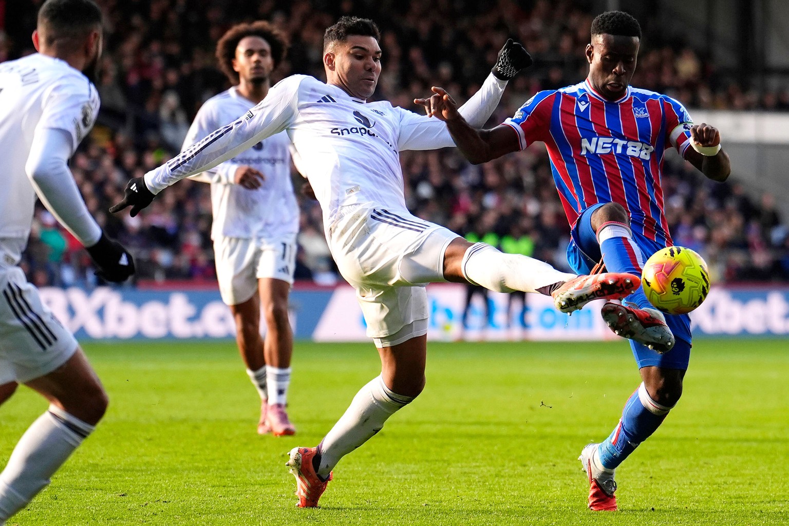 Manchester United&#039;s Casemiro and Crystal Palace&#039;s Marc Guehi, right, during the English Premier League soccer match between Crystal Palace and Manchester United in London, Sunday Nov. 30, 20 ...