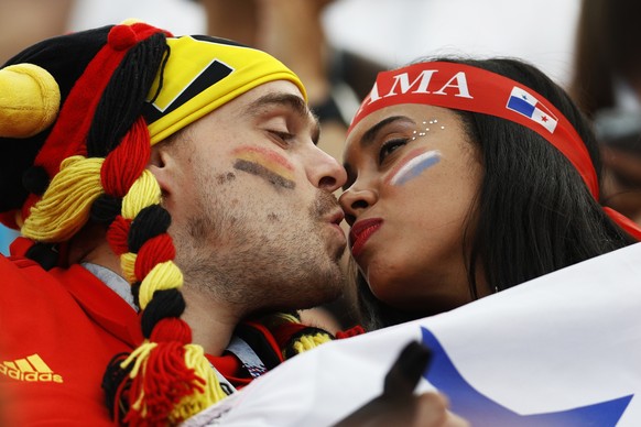 Panama, right, and Belgium fans kiss prior the group G match between Belgium and Panama at the 2018 soccer World Cup at the Fisht Stadium in Sochi, Russia, Monday, June 18, 2018. (AP Photo/Victor R. C ...