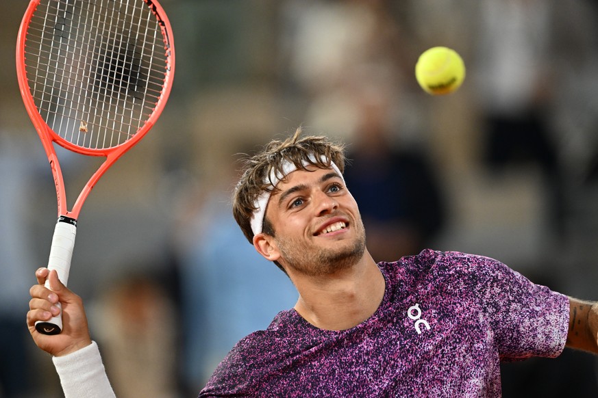 Italy's Flavio Cobolli reacts after winning the quarterfinal tennis match against Canada's Felix Auger-Aliassime at the French Open in Paris, Wednesday, June 3, 2026. (AP Photo/Emma Da Silva ...