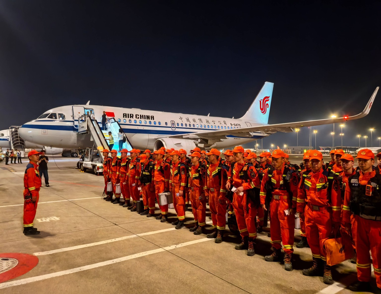 260827 -- BEIJING, Aug. 27, 2026 -- Rescuers with rescue and relief supplies prepare before heading to the mudslide-stricken Gyirong Port, at the Chengdu Shuangliu International Airport in Chengdu, so ...