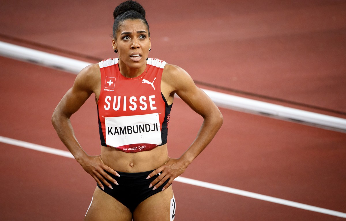 Mujinga Kambundji of Switzerland reacts after crossing the finish line after the women's athletics 200m final at the 2020 Tokyo Summer Olympics in Tokyo, Japan, on Tuesday, August 03, 2021. (KEYS ...