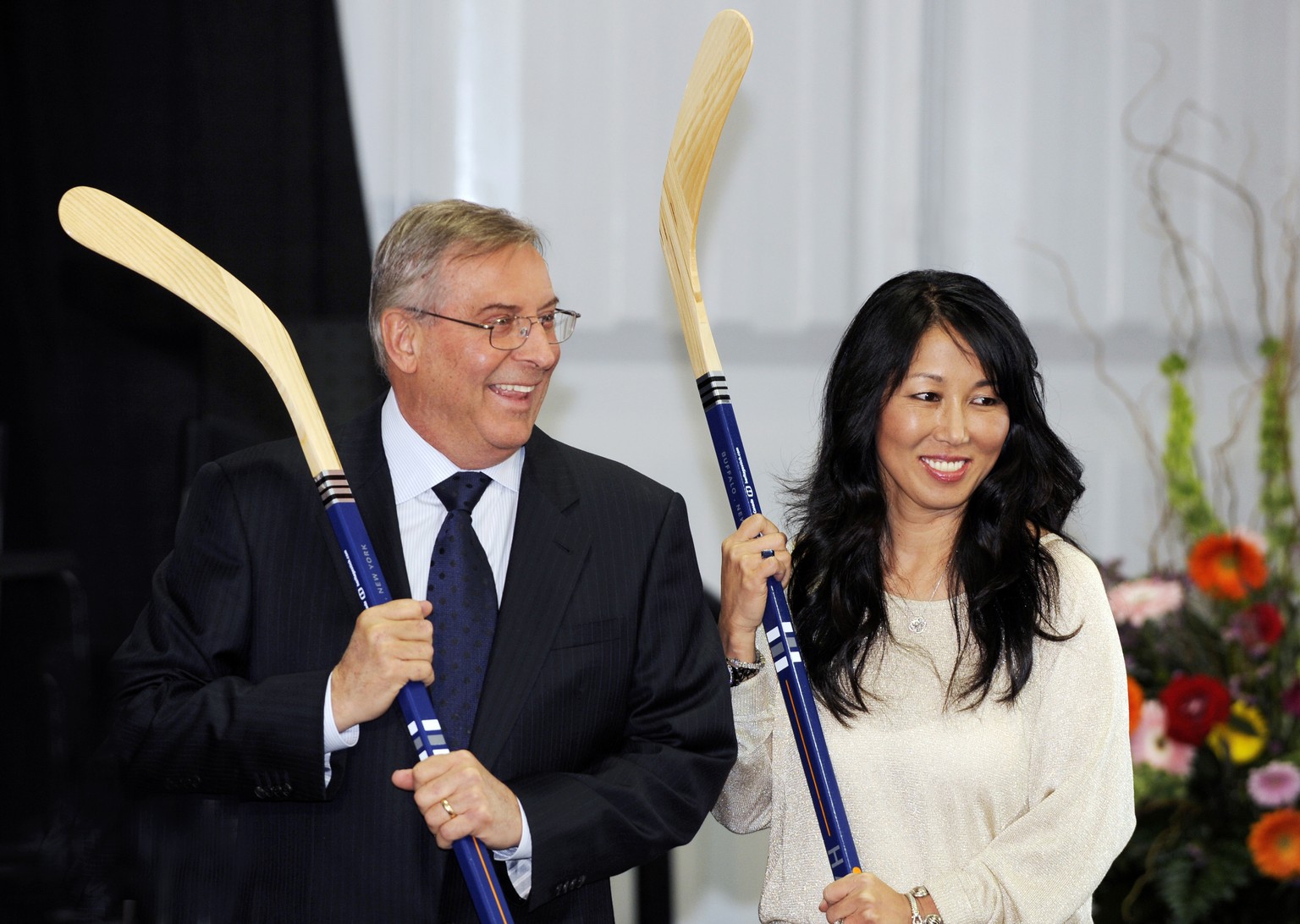 FILE - Buffalo Sabres&#039; owner Terry Pegula and his wife, Kim Pegula, pose for cameras during groundbreaking ceremonies at First Niagara Center before an NHL hockey game against the Philadelphia Fl ...