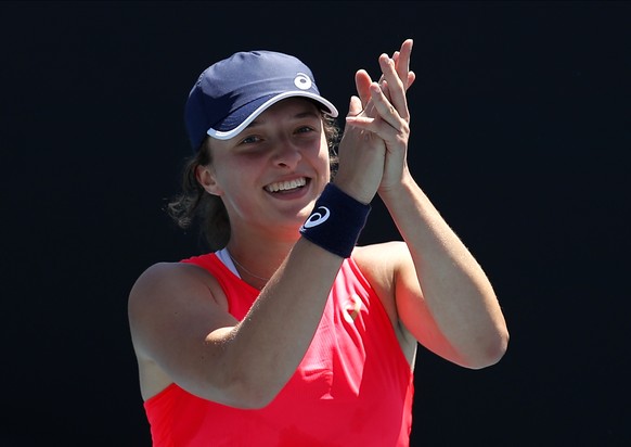 Poland&#039;s Iga Swiatek celebrates after defeating Croatia&#039;s Donna Vekic in their third round singles match at the Australian Open tennis championship in Melbourne, Australia, Saturday, Jan. 25 ...