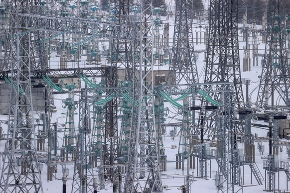 04.03.2024. Russia. Irkutsk region. Ust-Ilimsk. Power transmission lines on the territory of the Ust-Ilim hydroelectric power plant of the En Group company. Ust-Ilimskaya HPP is located on the Angara  ...