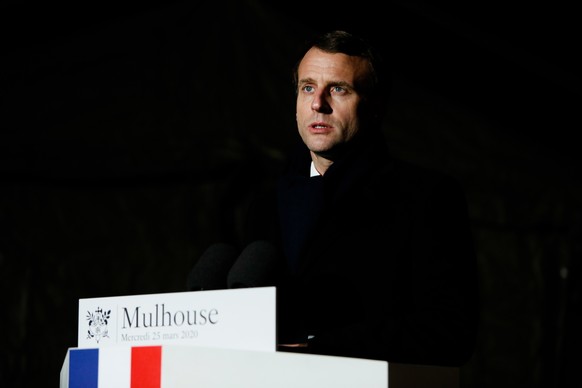 epa08322723 French President Emmanuel Macron delivers a speech after the visit of the military field hospital outside the Emile Muller Hospital in Mulhouse, eastern France, 25 March 2020, on the tenth ...