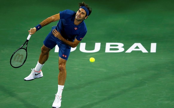 epa07397079 Roger Federer of Switzerland in action against Philipp Kohlschreiber of Germany during their first round match at the Dubai Duty Free Tennis ATP Championships 2019 in Dubai, United Arab Em ...