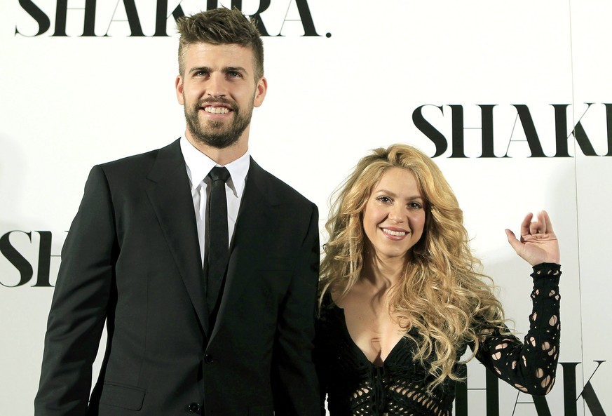 epa09995331 (FILE) - Colombian singer Shakira (R) poses for the media with her partner, FC Barcelona defender Gerard Pique (L), during the presentation of her new album &#039;Shakira&#039; in Barcelon ...