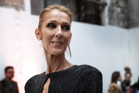 epa07309827 Canadian singer Celine Dion poses for the photographers prior to the Spring/Summer 2019 Haute Couture collection show by French designer Alexandre Vauthier during the Paris Fashion Week, i ...