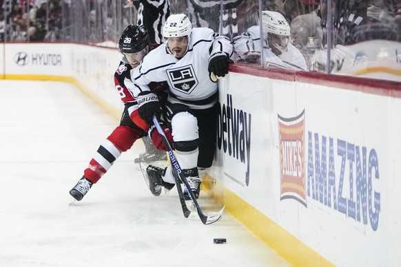Los Angeles Kings&#039; Kevin Fiala (22) fights for control of the puck with New Jersey Devils&#039; Damon Severson (28) during the first period of an NHL hockey game Thursday, Feb. 23, 2023, in Newar ...