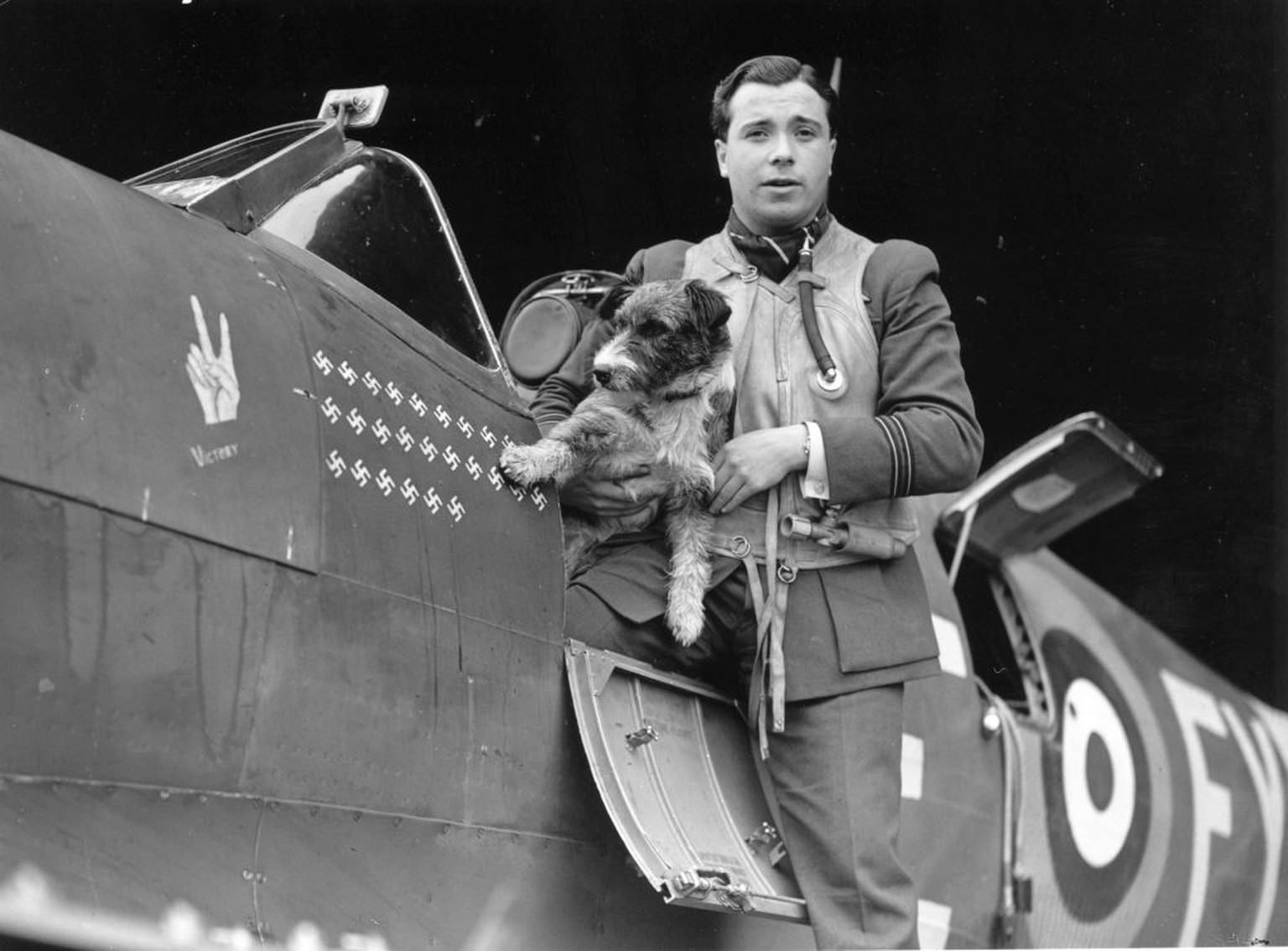 31st July 1941: Flight Lieutenant Eric Stanley Lock, DFC, and Bar, DSO, of 611 Squadron. Aircraft carries 'V' for Victory crest, and 26 swastikas showing his 26 Nazi kills. Stanley carries a ...