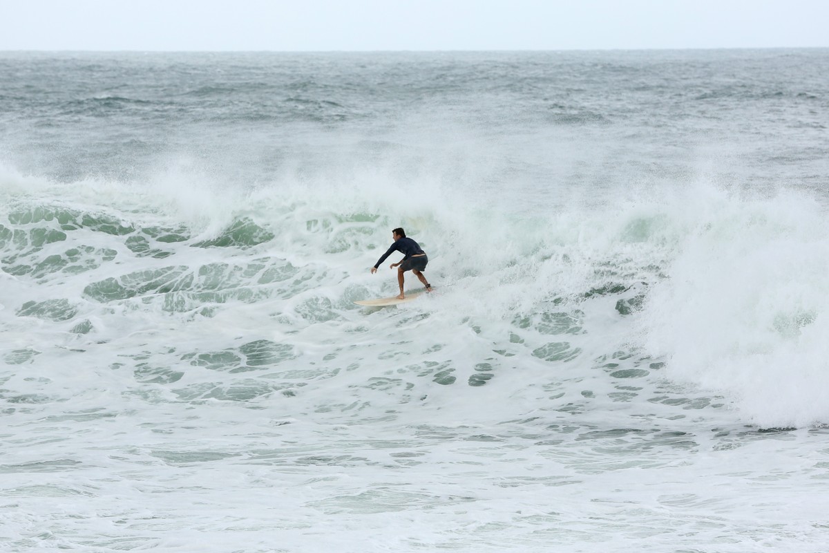epa11932155 A surfer catches a wave at Point Cartwright on the Sunnshine Coast, Queensland, Australia, 01 March 2025. Tropical Cyclone Alfred is sitting about 750km northeast of Mackay and producing w ...