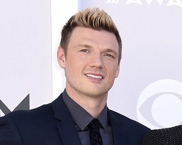 FILE - In this April 2, 2017 photo, Nick Carter of the Backstreet Boys arrives at the 52nd Annual Academy of Country Music Awards in Las Vegas.  Carter says hi