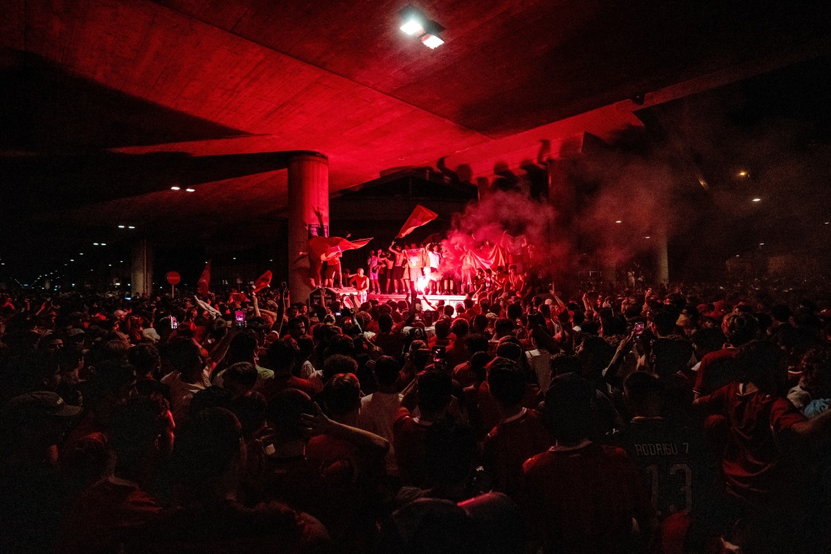 Fans of team Switzerland celebrate with flares as they gather on the streets arround the trainstation Hardbruecke after Switzerland won the 2026 FIFA World Cup soccer round of 16 soccer match against  ...