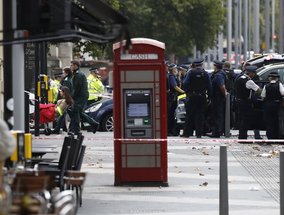 Ambulance personel push a woman on a stretcher at the scene of an incident in central London, Saturday, Oct. 7, 2017. London police say emergency services are outside the Natural History Museum in Lon ...