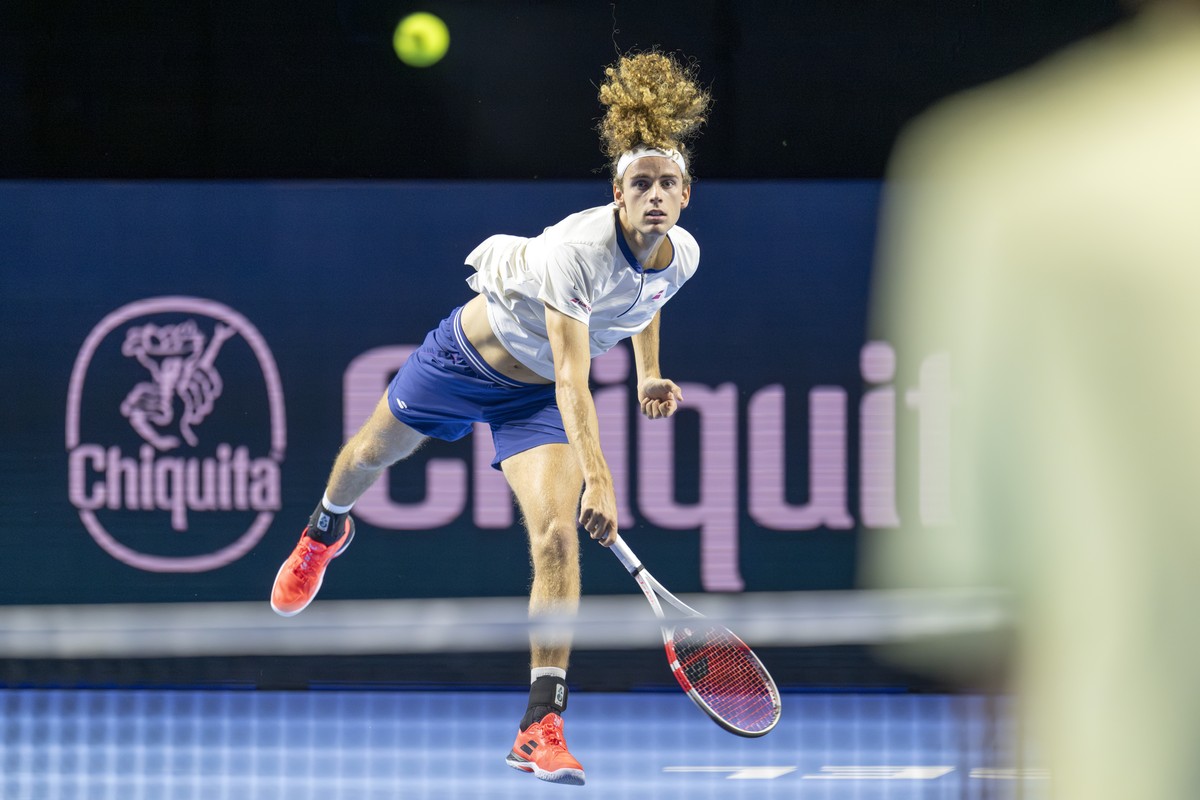Switzerland's Mika Brunold serves a ball to USA's Reilly Opelka during their qualifying match at the Swiss Indoors tennis tournament at the St. Jakobshalle in Basel, Switzerland, on Saturday ...